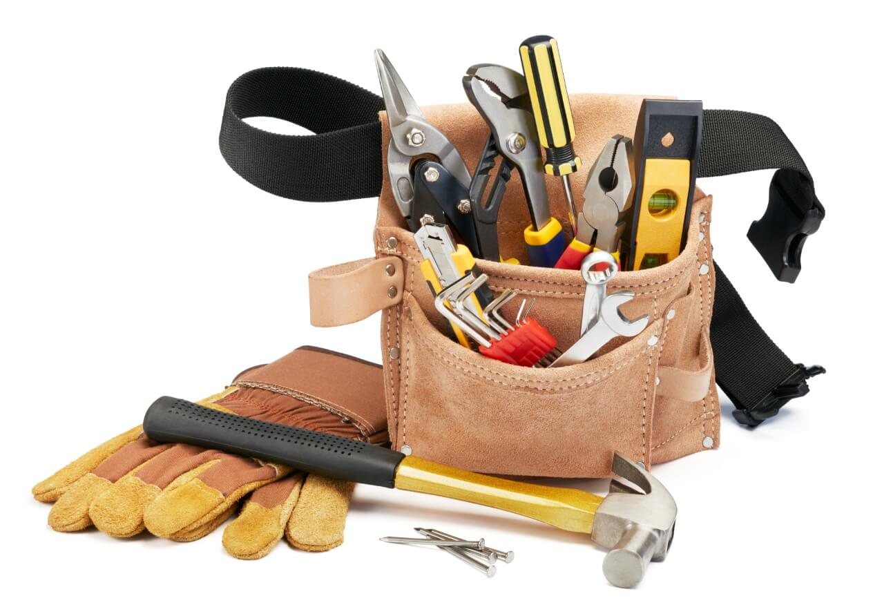 Toolbelt filled with various hand tools, gloves, and nails, ready for maintenance work.